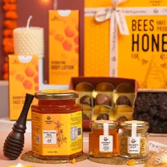 A warm and inviting shot of honey products styled for Diwali. The glowing lights and marigold flowers instantly create a festive atmosphere.