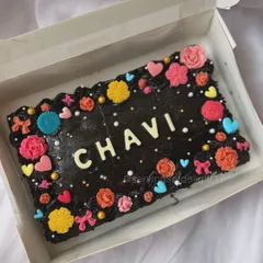 A pretty and colorful sheet cake for Chavi's birthday. This fudgy chocolate cake is decorated with a border of vibrant, handmade flowers and hearts.