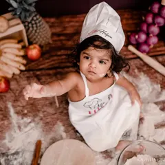 This little chef is taking a moment to consider her next culinary creation. I capture both the messy action and the sweet, thoughtful expressions in between.
