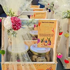 Celebrating "Mishka's 1st Lohri" with this elegant wooden tray hamper. It includes jars of treats and a personalized thank you card.