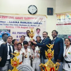 The entire team celebrating with our trophies after a successful tournament. The joy of victory is best when shared.