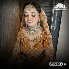 This shot captures the beautiful smile of the bride. Her makeup is subtle yet defining, letting her natural beauty shine through.