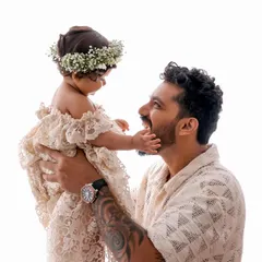 A father’s love is gentle and strong. This close-up from a dad and baby photoshoot highlights that special connection, a quiet moment of adoration that will be cherished for a lifetime.