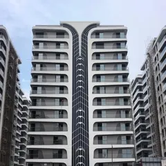 The facade of Rajhans Cremona in Surat showcases our passion for creating unique architectural forms. The flowing, organic lines are inspired by the shape of a violin, creating a visually dynamic structure that stands out in the urban landscape.