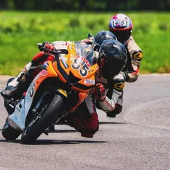 Proper race craft is learned through practice. Our training includes on-track sparring sessions where riders learn to navigate close-quarters racing, honing their overtaking skills and defensive lines against other talented racers.