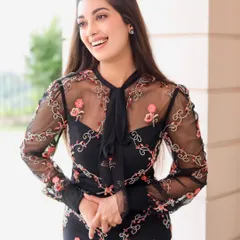 A candid, happy shot of Digangana. The natural makeup look enhances her features without looking heavy, making it perfect for this light and airy photoshoot.