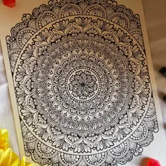 The future belongs to those who believe in the beauty of their dreams. This A4 mandala has a beautiful, lace-like quality, with delicate loops and fills.