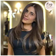 A slight turn of the head shows how this ashy brown color catches the light, revealing its cool, multi-tonal dimensions.