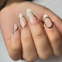 Dramatic and artistic. This design features bold, curved chrome lines over a cat-eye French base, creating a modern, sculptural effect on the nails.
