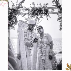 A black and white portrait of the couple during their beach wedding ceremony in Goa, filled with love and happiness.