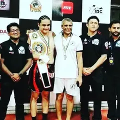 Our coaching staff and officials with a new champion. We are deeply involved in the competitive kickboxing circuit, ensuring our fighters get the best guidance and opportunities.