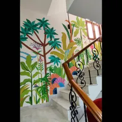 This vibrant tropical mural brings so much life and energy to a staircase. I enjoy playing with bold colors and lush foliage to transform transitional spaces into joyful parts of the home.