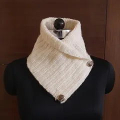 Our stylish crochet neck warmer in a classic off-white. This is a chic and practical alternative to a full scarf, perfect for layering over sweaters or under jackets for a sophisticated winter look.