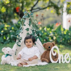 A classic first birthday portrait. This little boy looks so handsome sitting in his teepee tent, surrounded by teddy bears, ready to celebrate turning one.