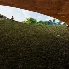 The Elephant Pavilion in Pollachi is a structure that merges with the landscape. A green roof provides thermal insulation and visual continuity, while a large oculus frames the sky, creating a space for observation that is shaped by the slope and sequence of the land itself.