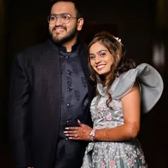 Client Deepak looking sharp for his sangeet party in a custom blue-on-blue Indo-Western outfit. The subtle print on the waistcoat adds a layer of texture and sophistication.
