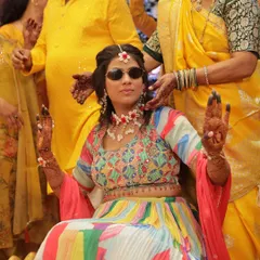 The cool bride moment! A fun shot of the bride wearing sunglasses during her Haldi ceremony.