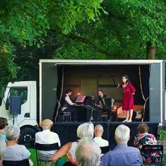 Our cabaret show on the road. This image shows us performing on a unique mobile stage built into a truck, allowing us to bring the theatre experience to diverse communities.