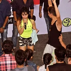 Interacting with the crowd during a Zumba event. It's all about connecting with people and sharing the joy of dance.