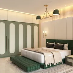 A serene master bedroom featuring a custom wardrobe with unique rounded-panel doors in a soothing green and white palette. The design is complemented by a matching upholstered bed and bench, creating a cohesive and tranquil retreat.