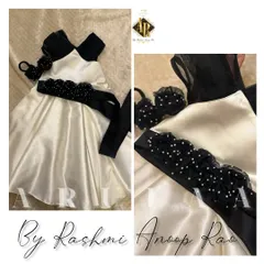 Another birthday frock option in ecru and black. This one features a beautiful belt with handmade rosettes and pearls, along with a matching hair accessory.