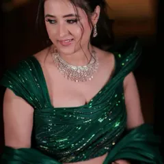 A close-up of the bride in her Gaurav Gupta gown, showcasing the intricate sequin work and the elegant diamond necklace.