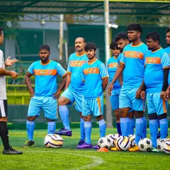 Aspiring coaches listen intently during a practical session of the AIFF D-License course. We provide a platform for coaches to learn modern, age-specific training methods.
