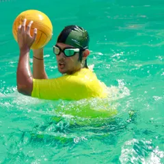 Fun and games with a friendly match of water polo. Activities like these help improve water confidence, teamwork, and agility in a playful way.