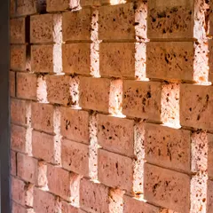 This image highlights the use of indigenous materials in my projects. The image shows a detail of a brick jali, or screen, which allows for natural ventilation while creating a beautiful play of light and shadow.