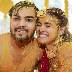A happy, turmeric-covered couple. These candid shots from the Haldi ceremony are always some of our favorites, full of genuine smiles and fun.