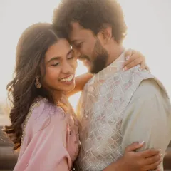 A gentle embrace filled with smiles and closed eyes. This photo captures a feeling of pure comfort and happiness in each other's arms during their engagement shoot.