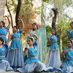 Here I am with a group of my students in their performance costumes. Seeing them ready to go on stage, filled with excitement and dedication, is a moment of great pride for me as their guru.