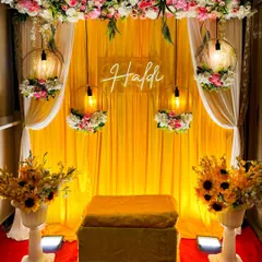 Here is a classic Haldi ceremony decor I created. The vibrant yellow backdrop, floral arrangements with sunflowers, and a custom neon "Haldi" sign create the perfect festive atmosphere for photos and rituals. This setup can be customized for any space, big or small.