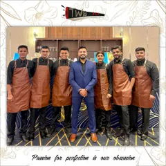 Our team of mixologists in custom leather aprons, posing with the event manager at an elegant engagement party. We pride ourselves on our professional appearance and teamwork.