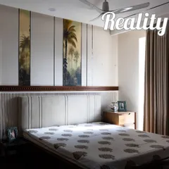 The reality of a parent's bedroom, which closely matches our visualization, showcasing the custom headboard and wall paneling.