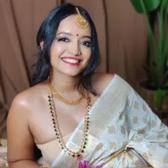 My stunning muse Athira, capturing the essence of a traditional South Indian look. Her captivating eyes, radiant skin, and classic red bindi create a picture of pure grace.