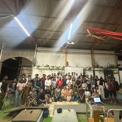 The 'Here to Hear' community. This group photo captures the speakers and listeners who came together for a powerful event on community mental health, sharing stories and strengthening connections.