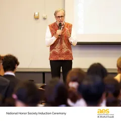 Our school director addresses the new inductees of the AES Honor Society. Membership in these societies is one of the highest honors a student can achieve, recognizing their holistic excellence.