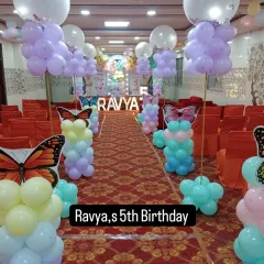 For Ravya's 5th birthday, we created a butterfly-themed walkway to welcome the guests. The balloon pillars with butterfly wings guide everyone to the main party area.
