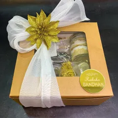 This is the fully packaged Raksha Bandhan hamper, tied with a beautiful ribbon and a festive flower. It’s designed to impress from the moment it's received, making your gift feel extra special.