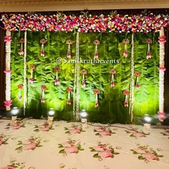 A lush and refreshing backdrop made entirely of fresh banana leaves. We've accented this natural wall with hanging garlands of jasmine and lotus buds, bringing an authentic South Indian feel to the event.