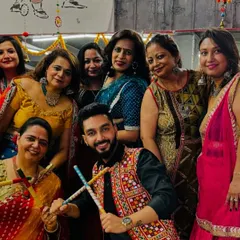 More smiles from our Dandiya celebration. I love seeing everyone, including myself, get into the festive spirit with dandiya sticks in hand.