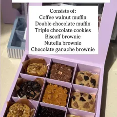 The Ultimate Sweet Treat Box menu. This box of nine includes assorted muffins, cookies, and brownies for the ultimate indulgence.