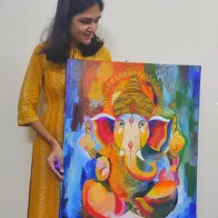 Holding the finished Ganesha painting. It’s always a special feeling to create something that will be a part of someone’s cherished memories and daily life.