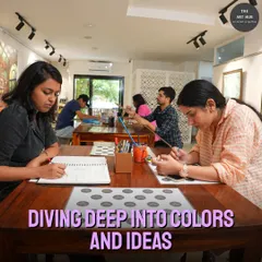 A wide view of our studio during a class, showing participants comfortably spread out and immersed in their work. We ensure ample space and resources for every individual to explore their ideas.