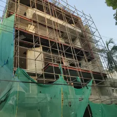 The same CR Park building during the construction phase, wrapped in scaffolding. This shows the transition from the structural frame to the finished facade, a process we manage with meticulous attention to detail.