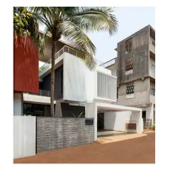 The 'Solid | Void | Solid House', completed in 2021. From the street, the house appears as a composition of opaque and transparent volumes, hinting at the private court at the back.