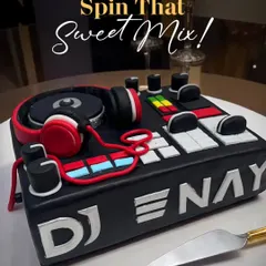 For the music lover in your life, I designed this custom DJ console cake. It features edible headphones, mixers, and turntables, making it the perfect centerpiece for a DJ's birthday bash.