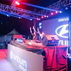 On stage at Sunburn Reload for a massive corporate event with Hyundai. I’m not just a DJ, I'm on the mic, hyping up thousands and making sure everyone is part of the show.