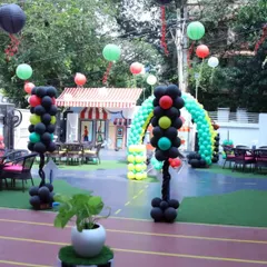 Our outdoor space fully decorated for a 'Cars' theme party, with balloon traffic lights and hanging lanterns creating a festive atmosphere.